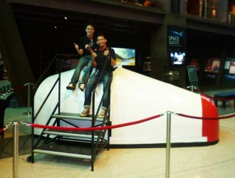 Two pilot candidates and the space capsule.